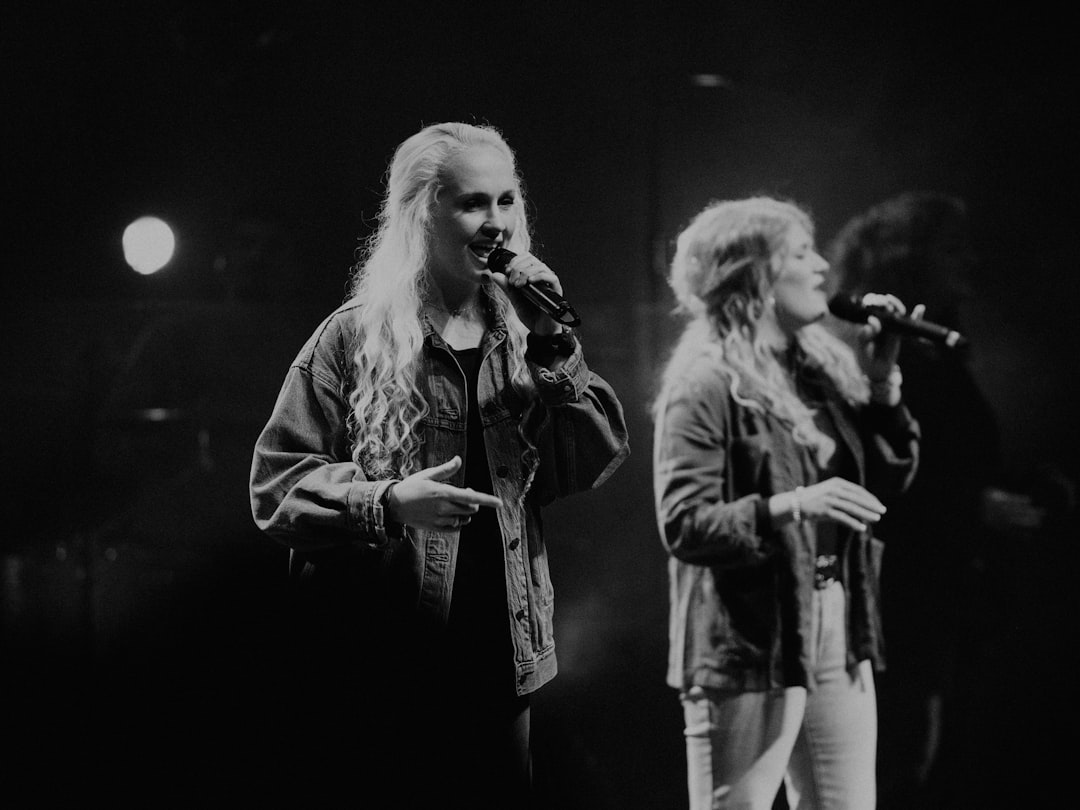 female singers on stage worshiping Jesus