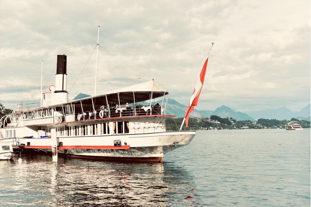 A large boat floating on top of a body of water